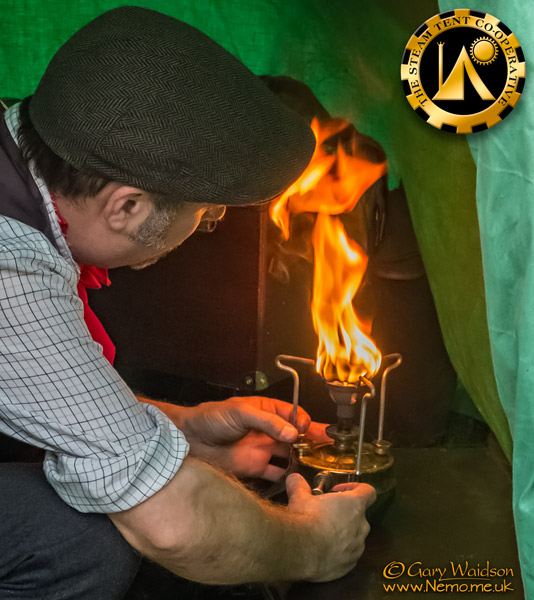 priming an old brass stove. The Steam Tent Co-operative. � Gary Waidson - www.Nemo.me.uk